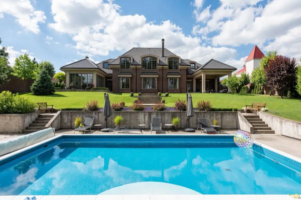 Paver pool deck around a backyard swimming pool in Brownsville, TX